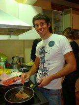 Villy with skillet in student kitchen