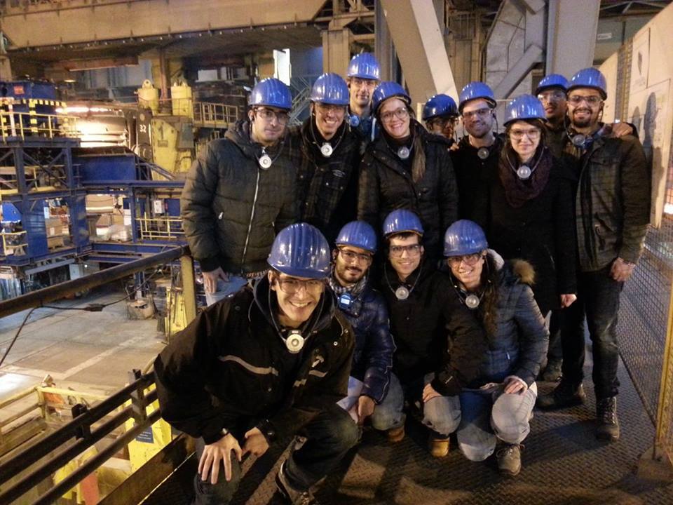 Group in hard hats in factory