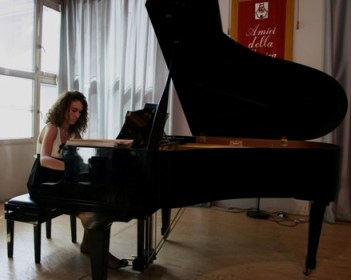Alice playing a grand piano