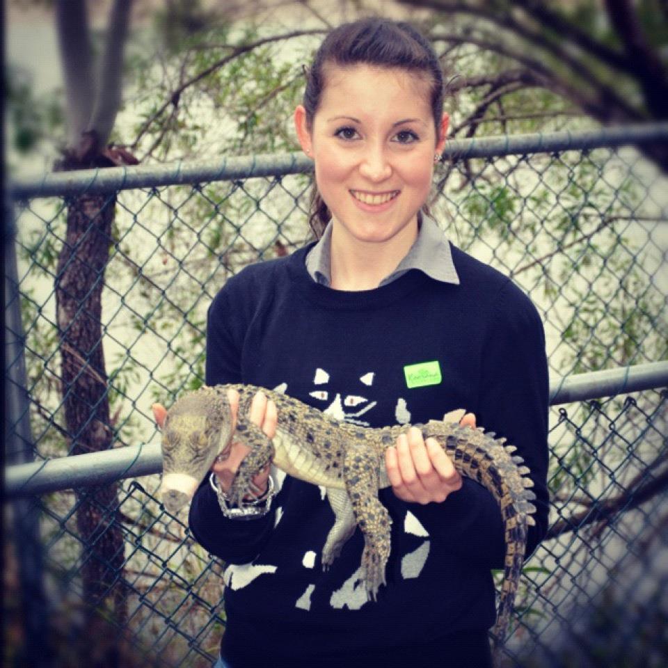 Student holding a crocodile