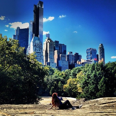 Student in park and skyline