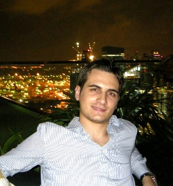 Remo headshot with an urban night background