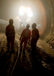Men standing in a tunnel