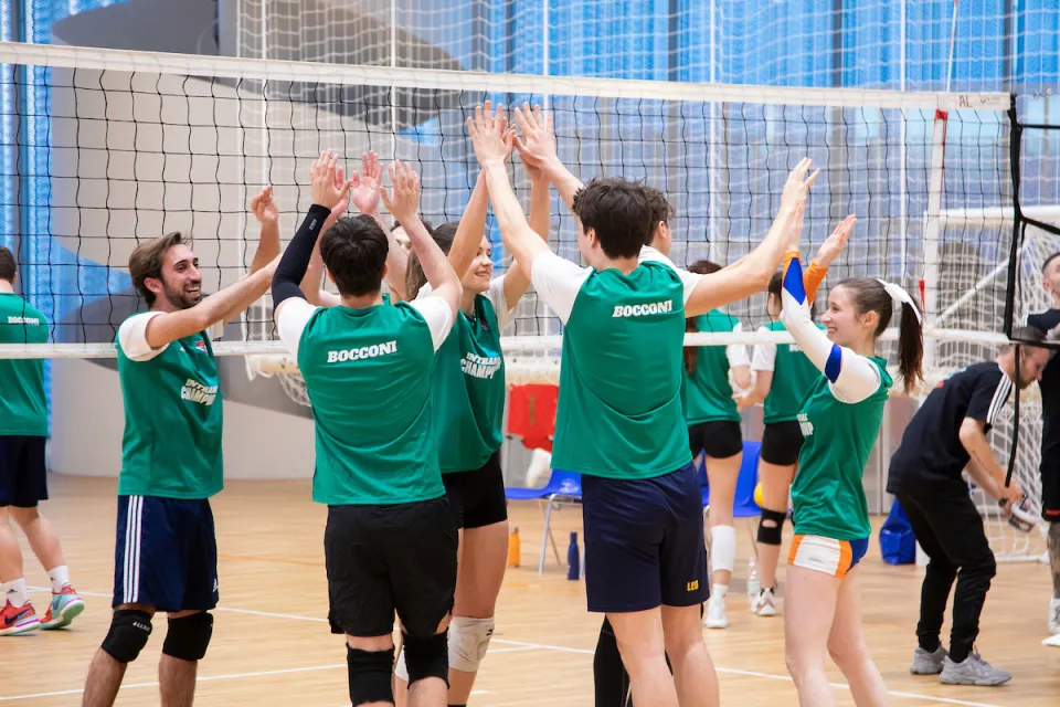 A team high five strengthens the resolve of the students on the volleyball team.