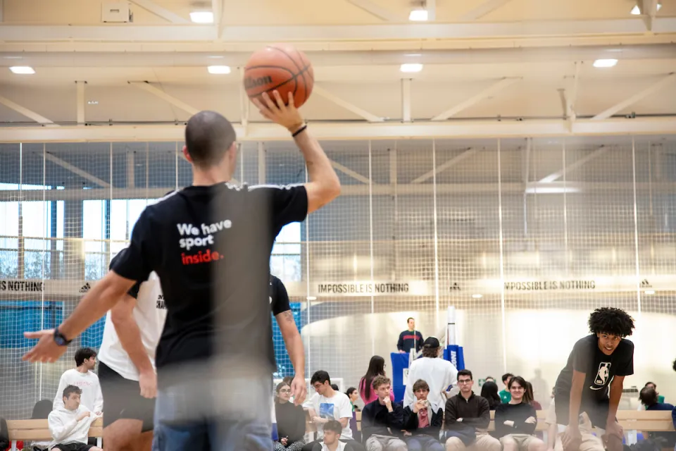 Some warm-up throws for the basketball team students.