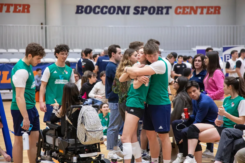 Two teammates hug to dampen the tension of the competition.