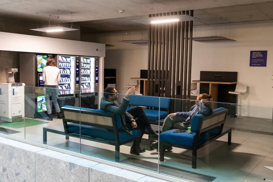 Professors discussing in the lounge area, Via Roentgen building.